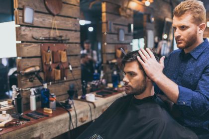 handsome-bearded-man-is-getting-hairstyle-by-haird-2021-08-29-12-16-08-utc.jpg