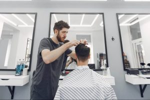 stylish-man-sitting-in-a-barbershop-2021-08-26-18-31-12-utc-e1663037894302.jpg